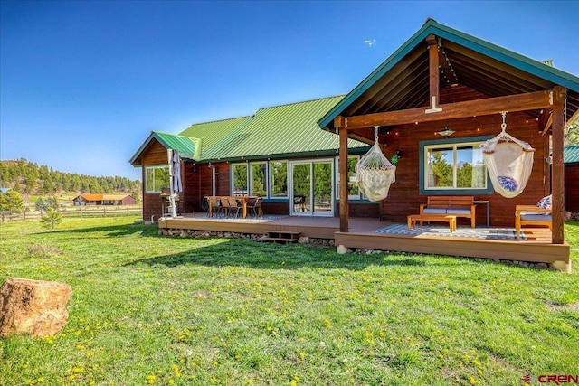 49 Sugarloaf Dr, Pagosa Springs, CO 81147 - back of property featuring a wooden deck and metal roof