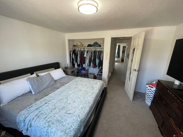 516 N 14th St Unit A, Gunnison, CO 81230 - carpeted bedroom featuring a textured ceiling and a closet