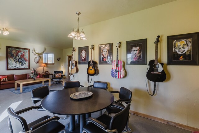 2439 County Road 359, Pagosa Springs, CO 81147 - dining area with baseboards and a chandelier