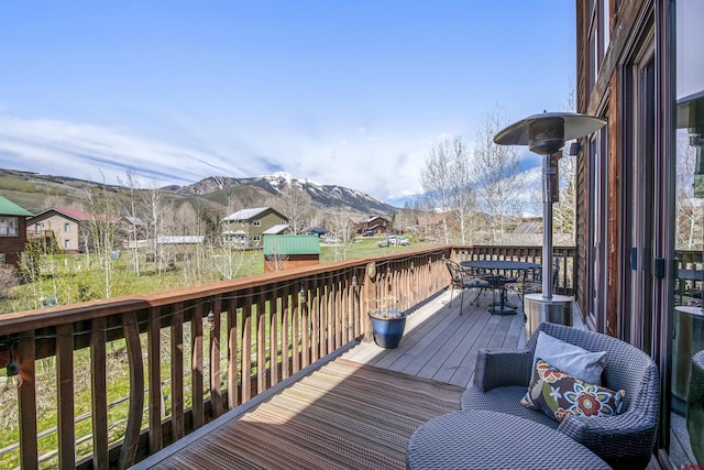 190 Teocalli Rd, Crested Butte, CO 81224 - wooden deck with a mountain view, outdoor dining space, and cooling unit