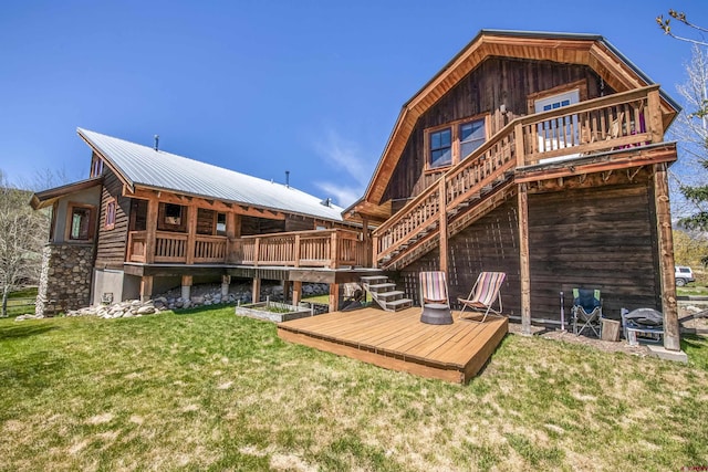 190 Teocalli Rd, Crested Butte, CO 81224 - rear view of house featuring a wooden deck, a yard, stairs, and metal roof