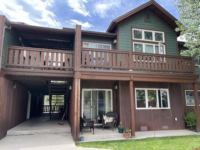 540 Redcliff Cir # E-104, Ridgway, CO 81432 - back of house with crawl space and a balcony