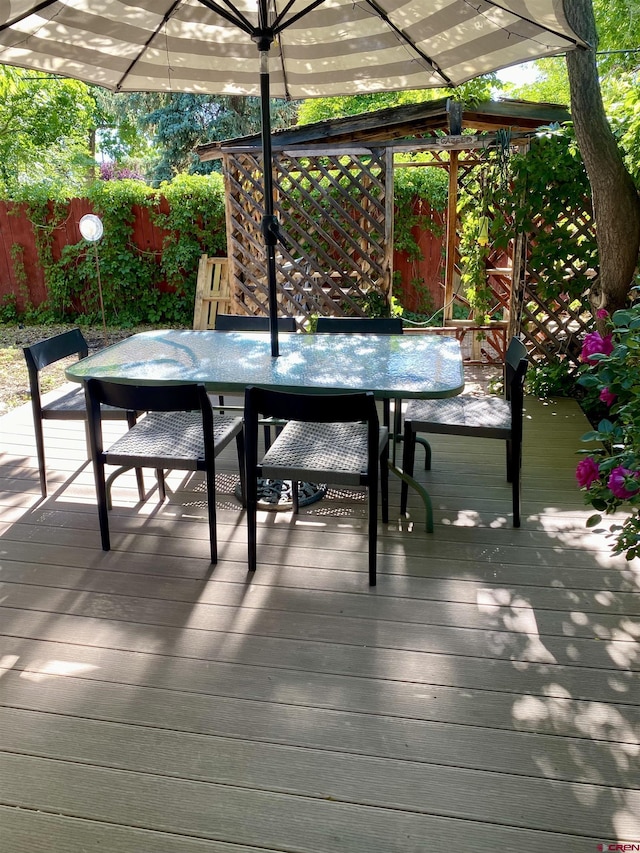 1615 Maple Ct, Grand Junction, CO 81505 - wooden terrace with outdoor dining area