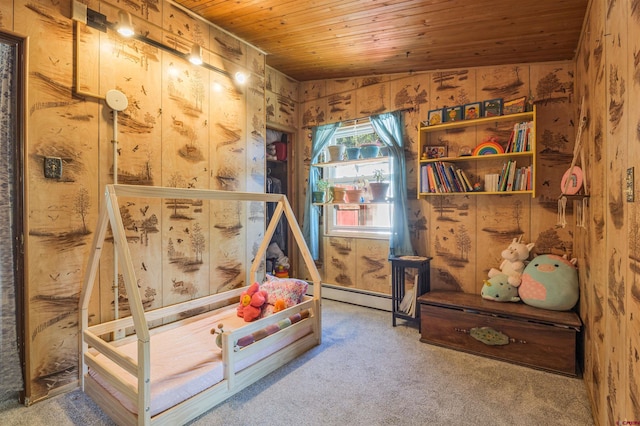 1615 Maple Ct, Grand Junction, CO 81505 - carpeted bedroom featuring wood ceiling, baseboard heating, and wood walls