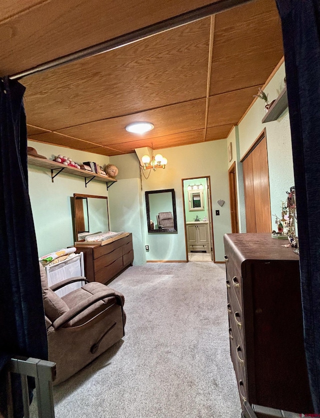 1615 Maple Ct, Grand Junction, CO 81505 - bedroom featuring carpet floors, a chandelier, and ensuite bathroom