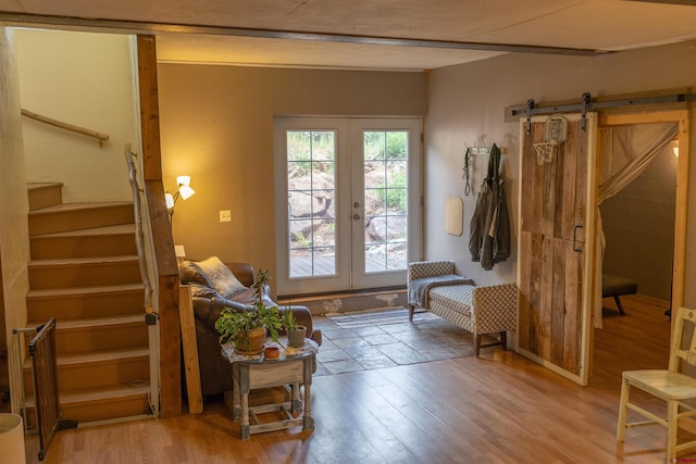 51 Blake St, Placerville, CO 81430 - entrance foyer with stairway, french doors, light wood-style floors, and a barn door