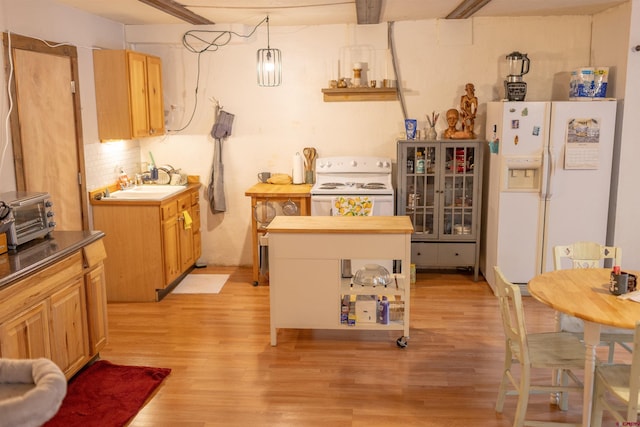 51 Blake St, Placerville, CO 81430 - kitchen featuring white appliances, light wood-style flooring, and a sink