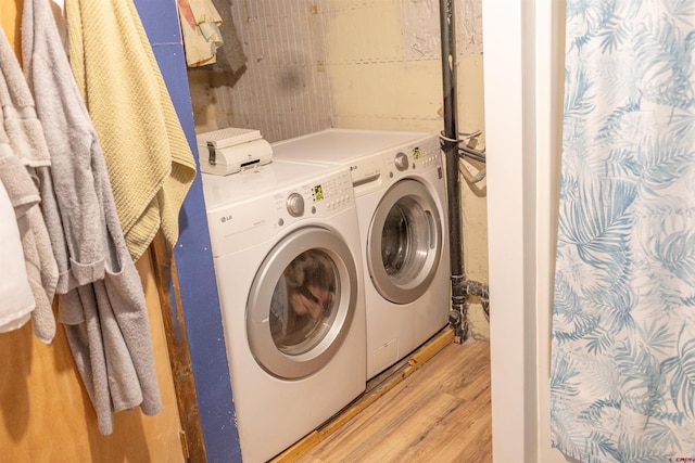 51 Blake St, Placerville, CO 81430 - washroom featuring washing machine and clothes dryer and light wood-style flooring
