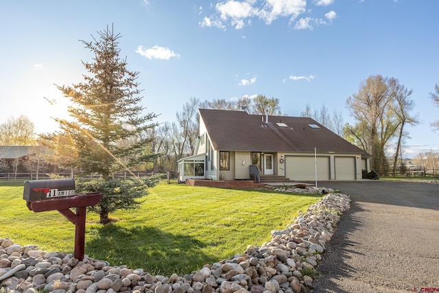 11 Amigo Way, Gunnison, CO 81230 - view of front of property with driveway and a garage