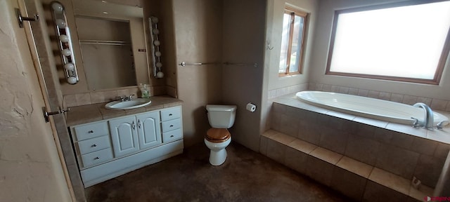 12912 3100th Rd, Hotchkiss, CO 81419 - bathroom featuring a garden tub, toilet, and vanity