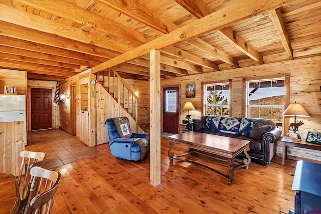 LOT7 Aspen Hills Rd, Cedaredge, CO 81413 - living area featuring wood walls, wooden ceiling with exposed beams, wood-type flooring, and stairway