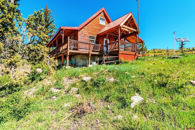 LOT7 Aspen Hills Rd, Cedaredge, CO 81413 - back of property with a wooden deck, metal roof, and faux log siding