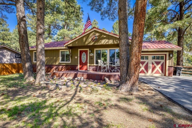 43 W Radiant Ct, Pagosa Springs, CO 81147 - view of front of home featuring concrete driveway and a porch