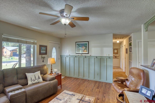 43 W Radiant Ct, Pagosa Springs, CO 81147 - living room featuring a textured ceiling, wood finished floors, and ceiling fan