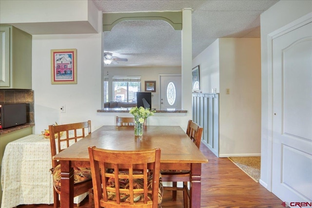 43 W Radiant Ct, Pagosa Springs, CO 81147 - dining room with ceiling fan, wood finished floors, a textured ceiling, and baseboards