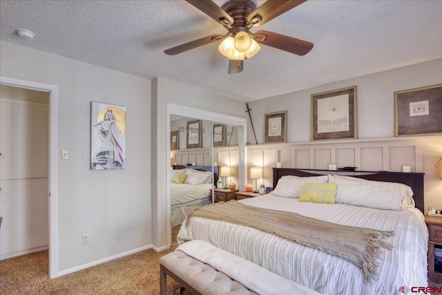 43 W Radiant Ct, Pagosa Springs, CO 81147 - bedroom featuring light colored carpet, a textured ceiling, a ceiling fan, and baseboards