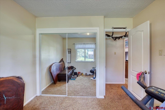 43 W Radiant Ct, Pagosa Springs, CO 81147 - carpeted bedroom featuring a textured ceiling, a closet, and baseboards
