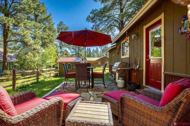 43 W Radiant Ct, Pagosa Springs, CO 81147 - fenced backyard with outdoor lounge area, a patio area, outdoor dining space, and area for grilling