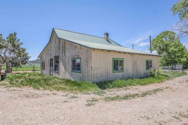 42254 Piburn Flats Rd, Crawford, CO 81415 - view of property exterior featuring a chimney and metal roof