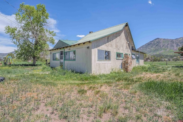 42254 Piburn Flats Rd, Crawford, CO 81415 - view of side of home with metal roof and a mountain view
