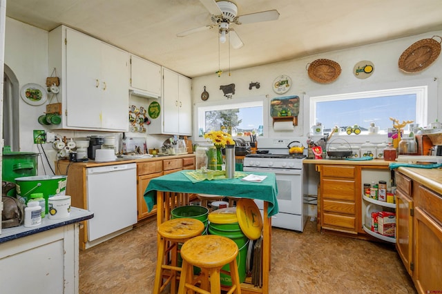 42254 Piburn Flats Rd, Crawford, CO 81415 - kitchen with white appliances, ceiling fan, white cabinets, a sink, and arched walkways