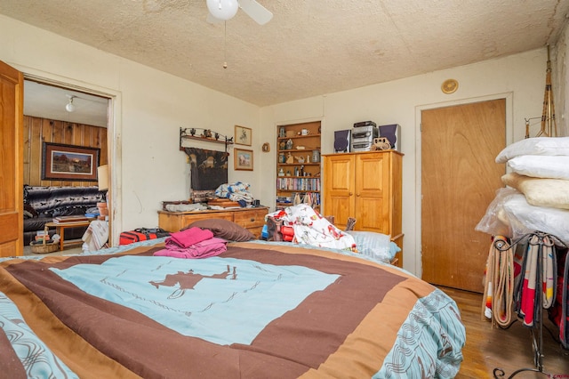 42254 Piburn Flats Rd, Crawford, CO 81415 - bedroom with a textured ceiling, wood finished floors, and a ceiling fan