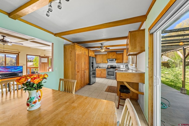 2503 Borrego Dr, Durango, CO 81301 - dining area with a ceiling fan, beamed ceiling, plenty of natural light, and light tile patterned floors
