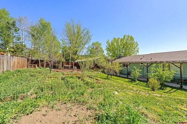 2503 Borrego Dr, Durango, CO 81301 - fenced backyard featuring a vegetable garden