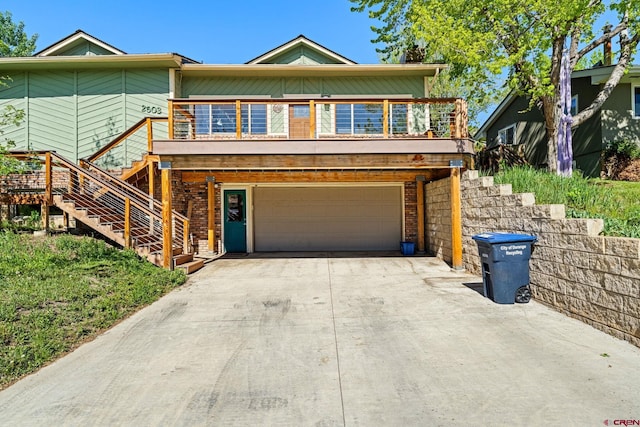 2503 Borrego Dr, Durango, CO 81301 - view of front of home featuring stairs, an attached garage, and driveway