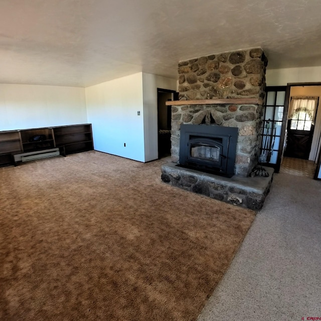 17992 Hanson Rd, Cedaredge, CO 81413 - unfurnished living room with carpet flooring and a stone fireplace