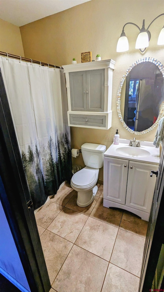 1625 Keepsake Loop, Westcliffe, CO 81252 - bathroom featuring toilet, vanity, and tile patterned flooring