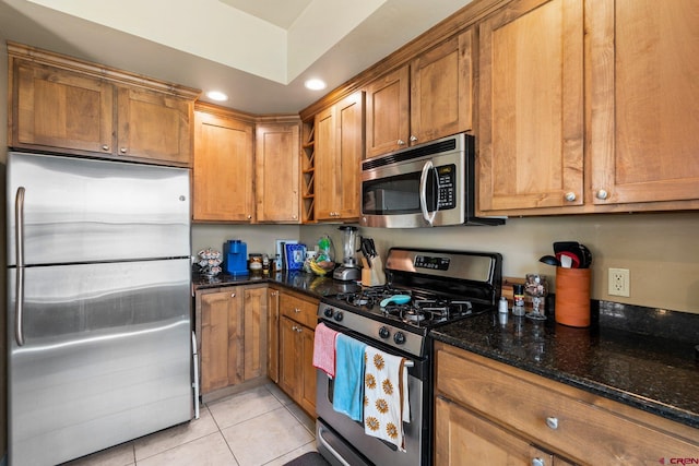 236 Sierra Vista St, Durango, CO 81301 - kitchen with appliances with stainless steel finishes, brown cabinetry, light tile patterned floors, recessed lighting, and open shelves
