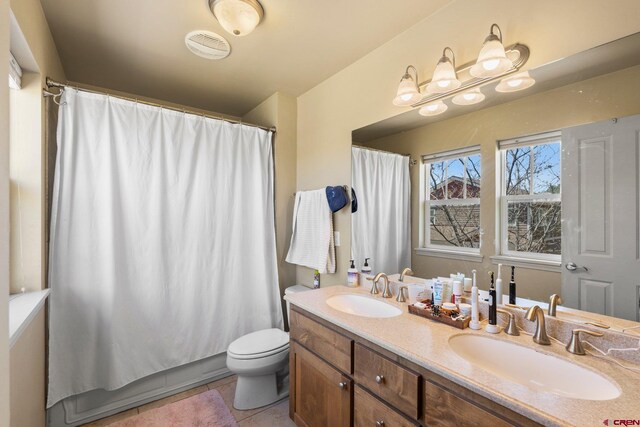 236 Sierra Vista St, Durango, CO 81301 - bathroom featuring double vanity, toilet, and tile patterned floors