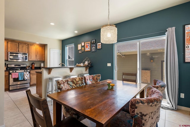 236 Sierra Vista St, Durango, CO 81301 - dining space with light tile patterned floors, recessed lighting, a chandelier, and baseboards