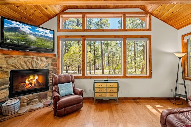 380 Eagle Pass, Durango, CO 81301 - living area with lofted ceiling, plenty of natural light, hardwood / wood-style flooring, baseboards, and a fireplace