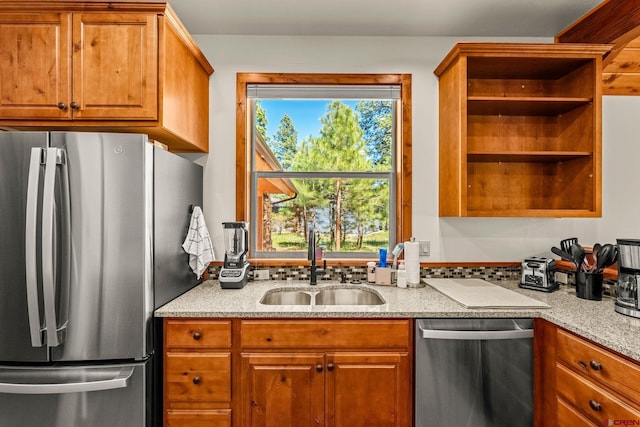 380 Eagle Pass, Durango, CO 81301 - kitchen featuring appliances with stainless steel finishes, open shelves, a sink, and brown cabinets