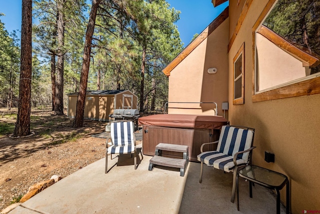 380 Eagle Pass, Durango, CO 81301 - view of patio with a hot tub and view of scattered trees