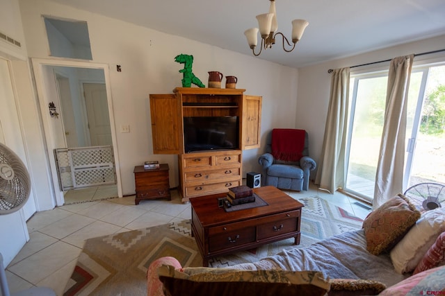13569 3100th Rd, Hotchkiss, CO 81419 - living room featuring light tile patterned flooring and a chandelier
