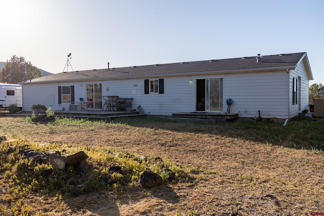 13569 3100th Rd, Hotchkiss, CO 81419 - back of house featuring a wooden deck
