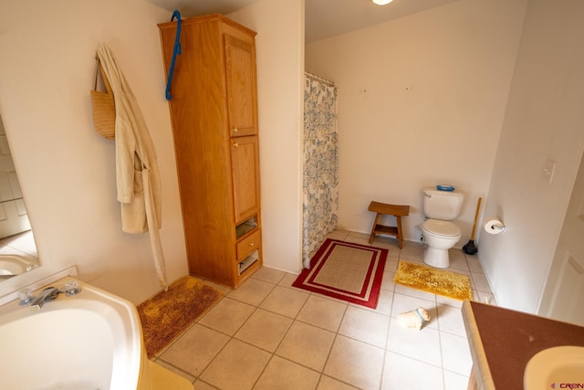 13569 3100th Rd, Hotchkiss, CO 81419 - full bathroom featuring vanity, toilet, tile patterned flooring, and a shower with curtain