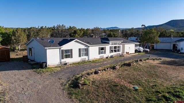 13569 3100th Rd, Hotchkiss, CO 81419 - ranch-style house with a mountain view and a shingled roof