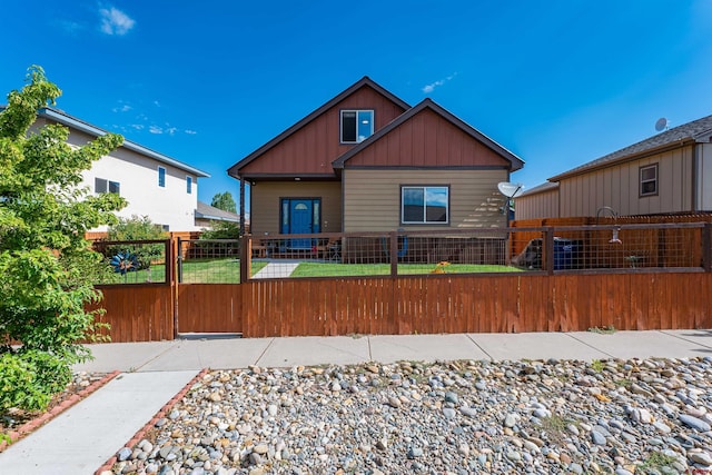 1607 S Taylor Cir, Bayfield, CO 81122 - view of front of property with board and batten siding and a fenced front yard