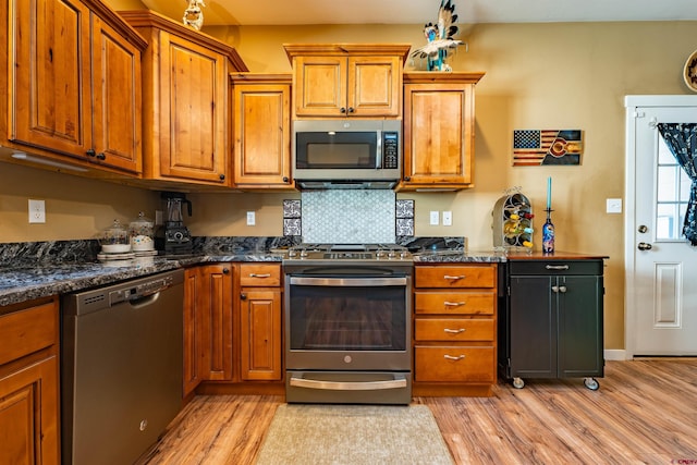 1607 S Taylor Cir, Bayfield, CO 81122 - kitchen featuring appliances with stainless steel finishes, brown cabinets, and light wood finished floors