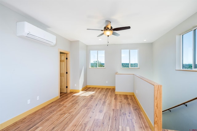 7 Yarrow Ct, Durango, CO 81301 - spare room featuring a wall mounted air conditioner, baseboards, light wood-style floors, ceiling fan, and recessed lighting