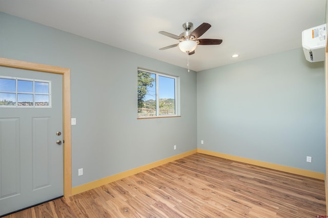 7 Yarrow Ct, Durango, CO 81301 - foyer entrance featuring baseboards, light wood-style floors, ceiling fan, recessed lighting, and a wall unit AC
