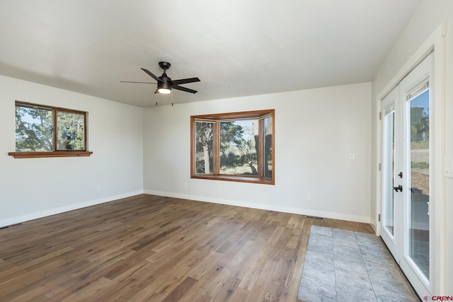 41 Ridge Pl, Durango, CO 81301 - unfurnished room featuring plenty of natural light, wood finished floors, and baseboards