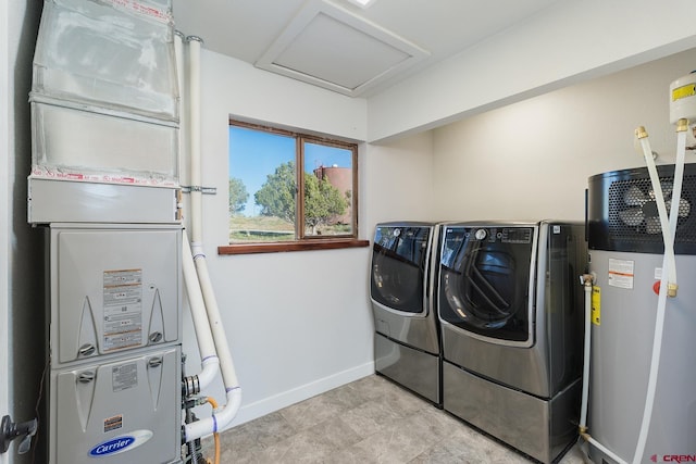 41 Ridge Pl, Durango, CO 81301 - washroom featuring water heater, washing machine and clothes dryer, baseboards, and attic access