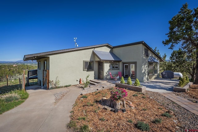 41 Ridge Pl, Durango, CO 81301 - view of front of property with stucco siding and a patio