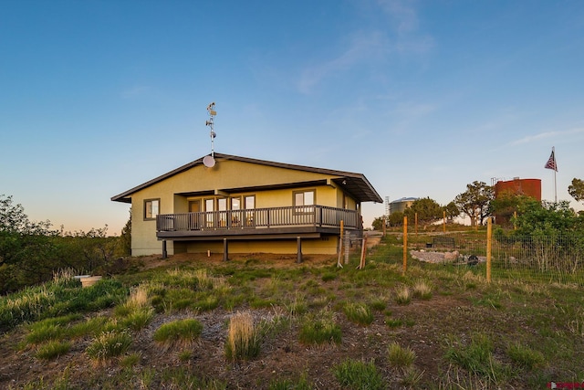 41 Ridge Pl, Durango, CO 81301 - back of property at dusk featuring a deck and stucco siding