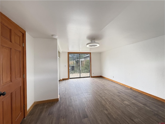 1246 Meeker St, Delta, CO 81416 - spare room with baseboards, dark wood-style flooring, and a smoke detector